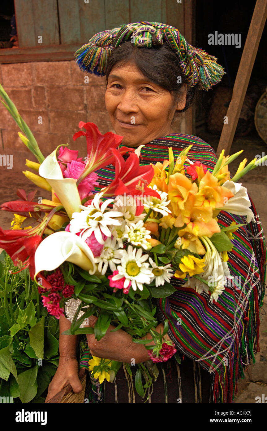 Guatemala, Nebaj, Mayan, Guatemalan woman in native dress with flower