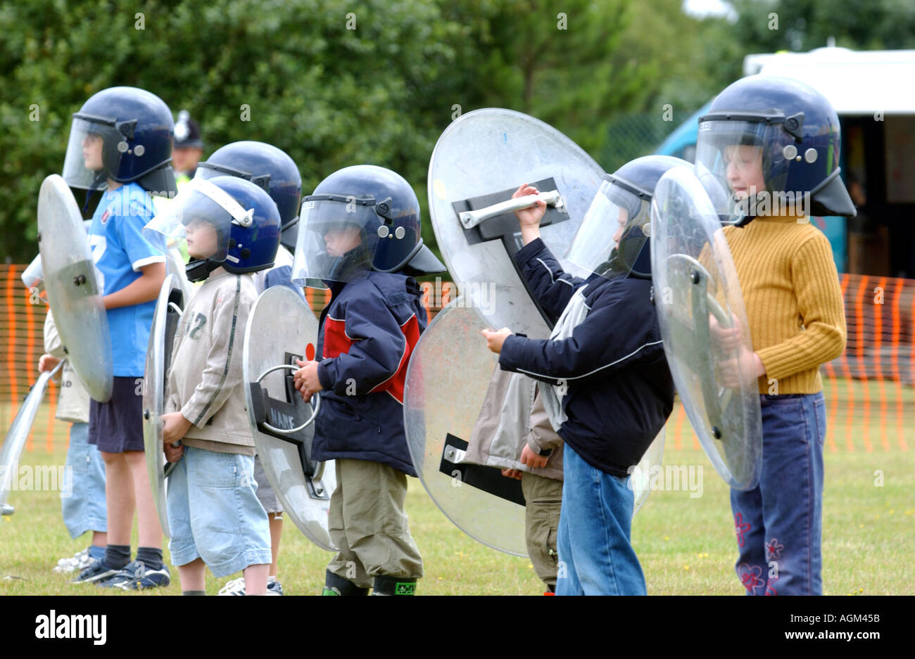 Children play at being riot police during a police headquarters open ...