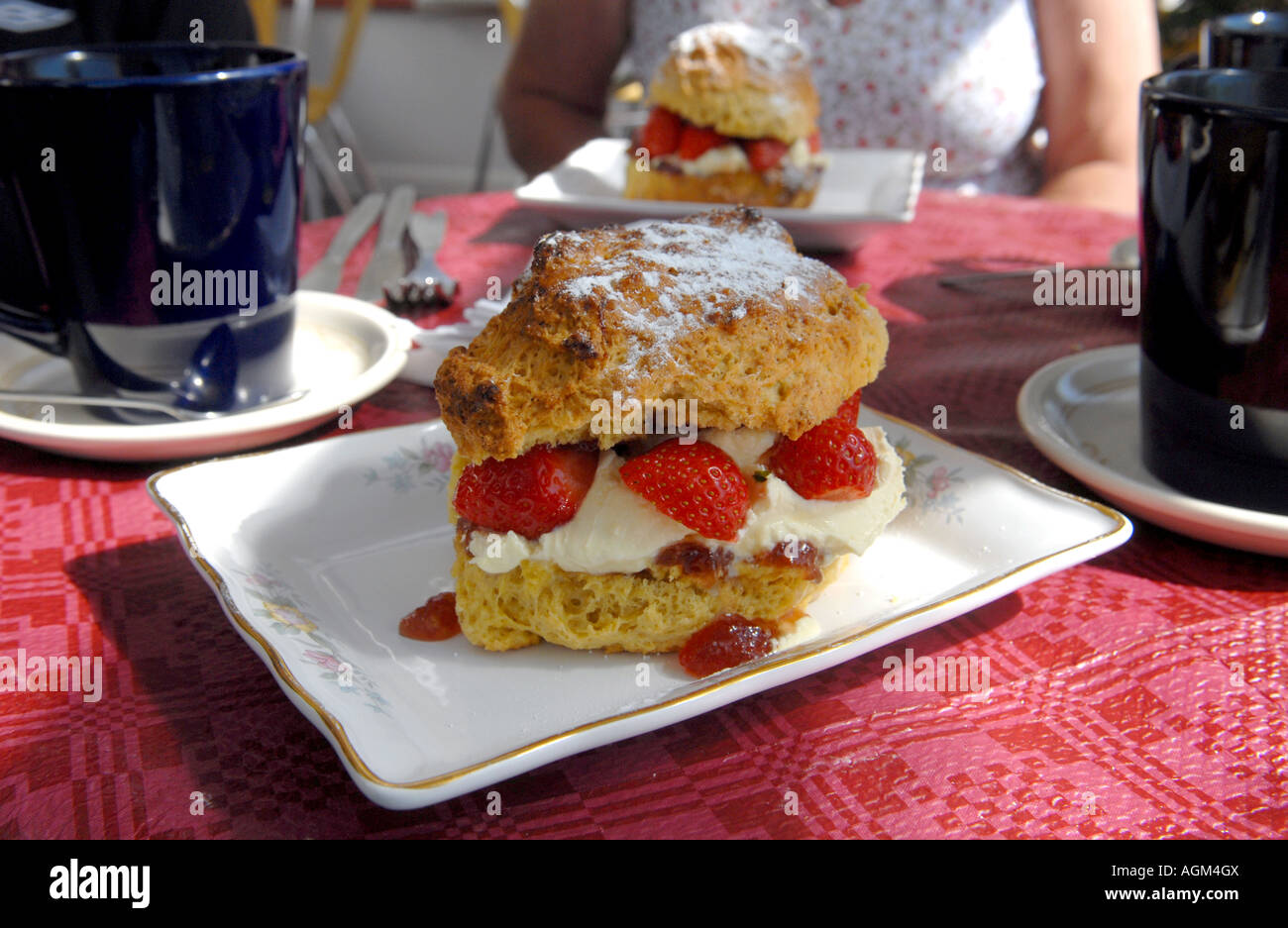 A DEVONSHIRE CREAM SCONE  WITH STRAWBERRIES RE FOOD CALORIES DIETS DIETING SUGAR OBESITY ETC UK Stock Photo