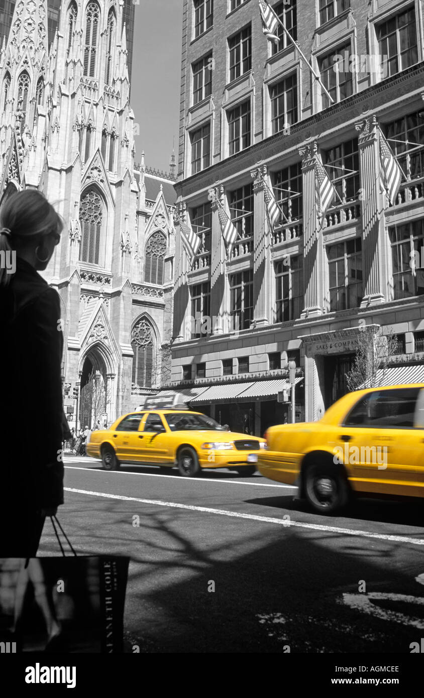 WOMAN WAITING FOR CAB OPPOSITE SAKES 5TH AVENUE Stock Photo