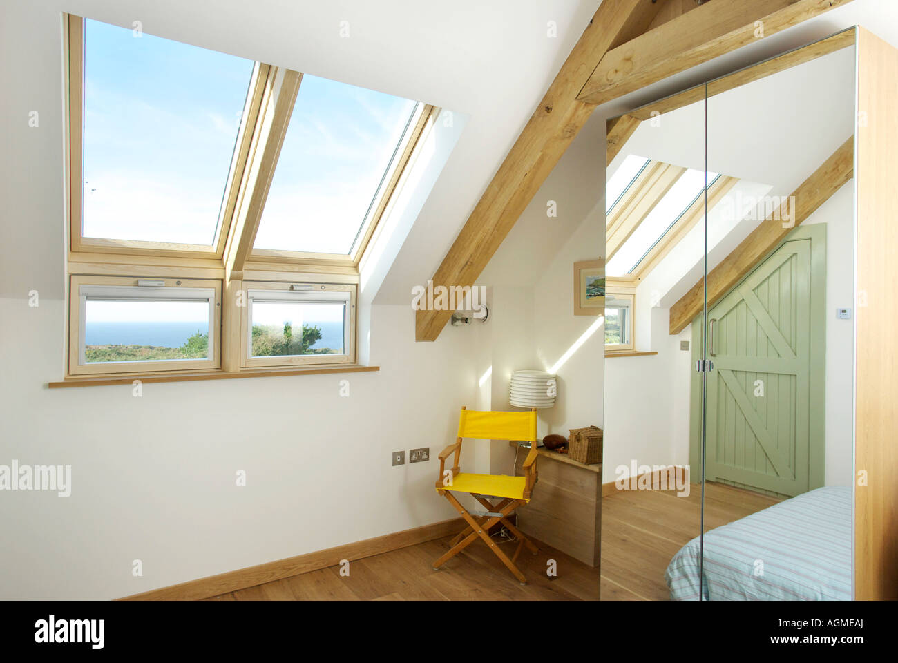 Bedroom in loft conversion with skylight windows Stock Photo