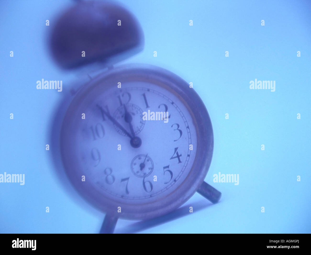 alarm clock showing time five for twelve about time Stock Photo Alamy