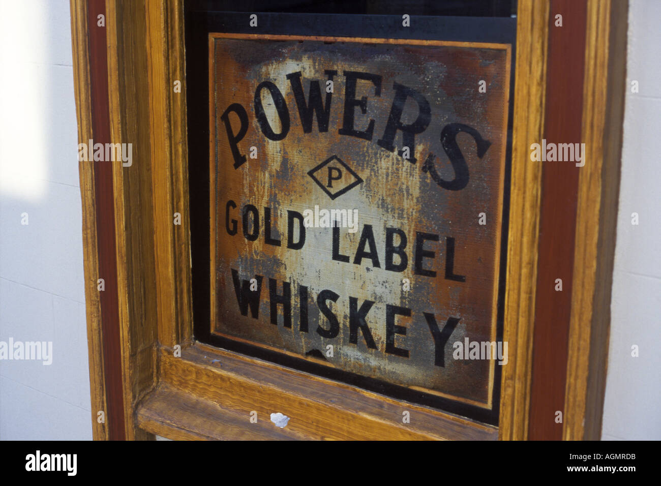Powers Gold Label Whiskey sign in the window of a pub in Drogheda Ireland Stock Photo