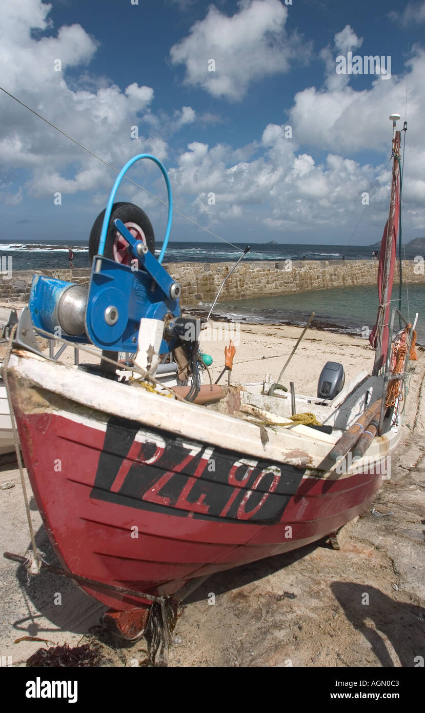 A Cornish fishing boat in dry harbor until the tide turns and it can be used for the next fishing trip Stock Photo