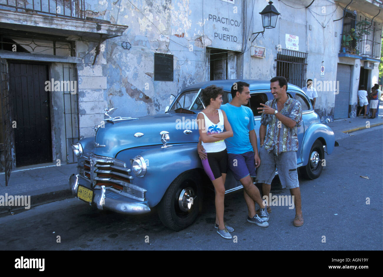Cuba Havana People standing in front of old car Stock Photo