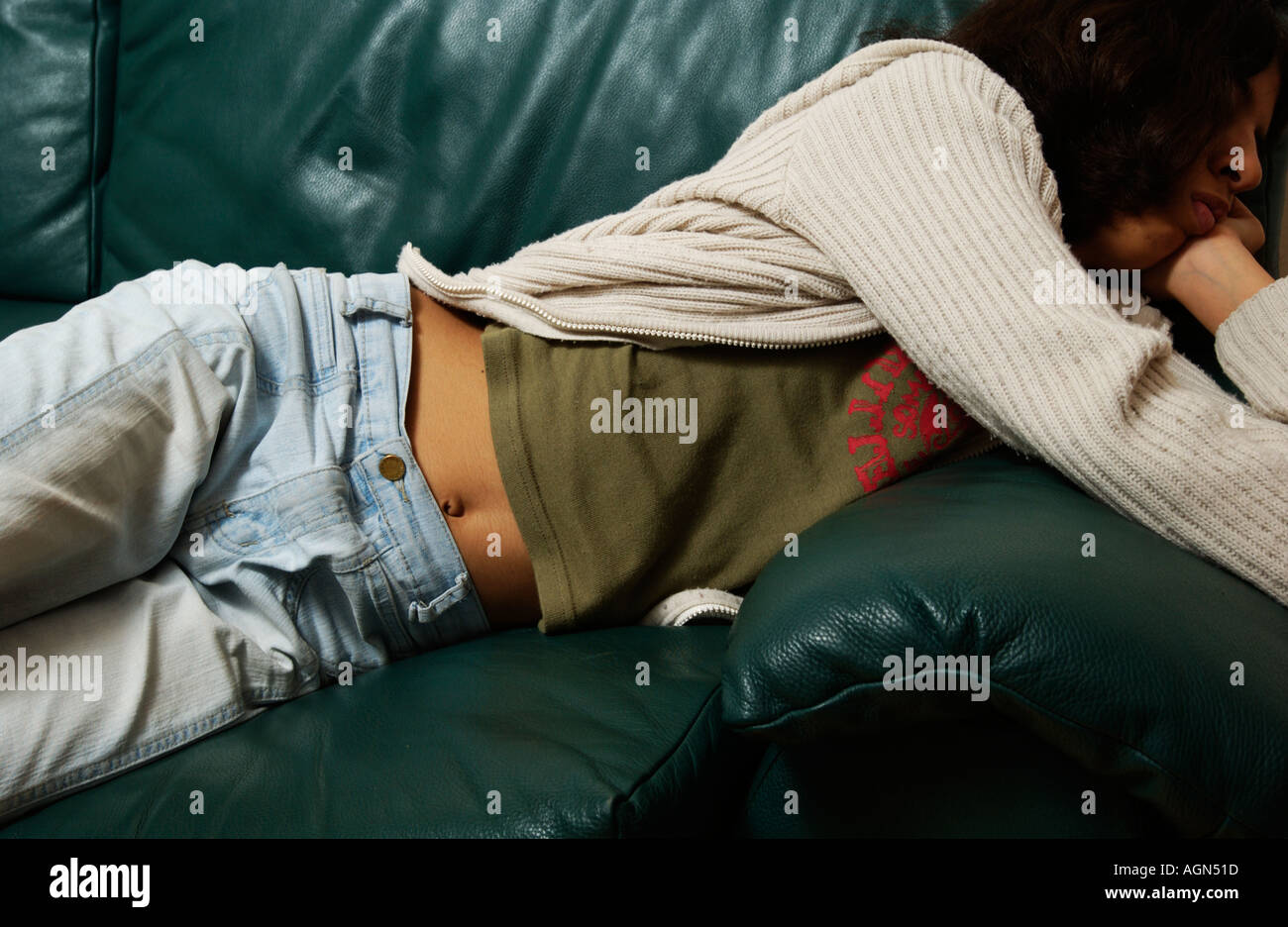 Girl on sofa hi-res stock photography and images - Alamy
