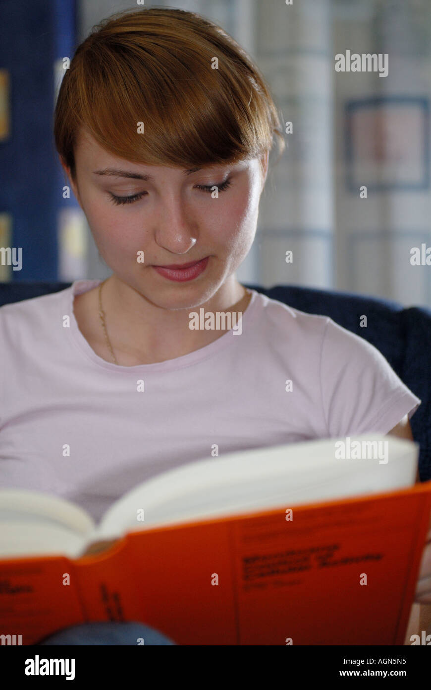 young girl reading science book Stock Photo - Alamy