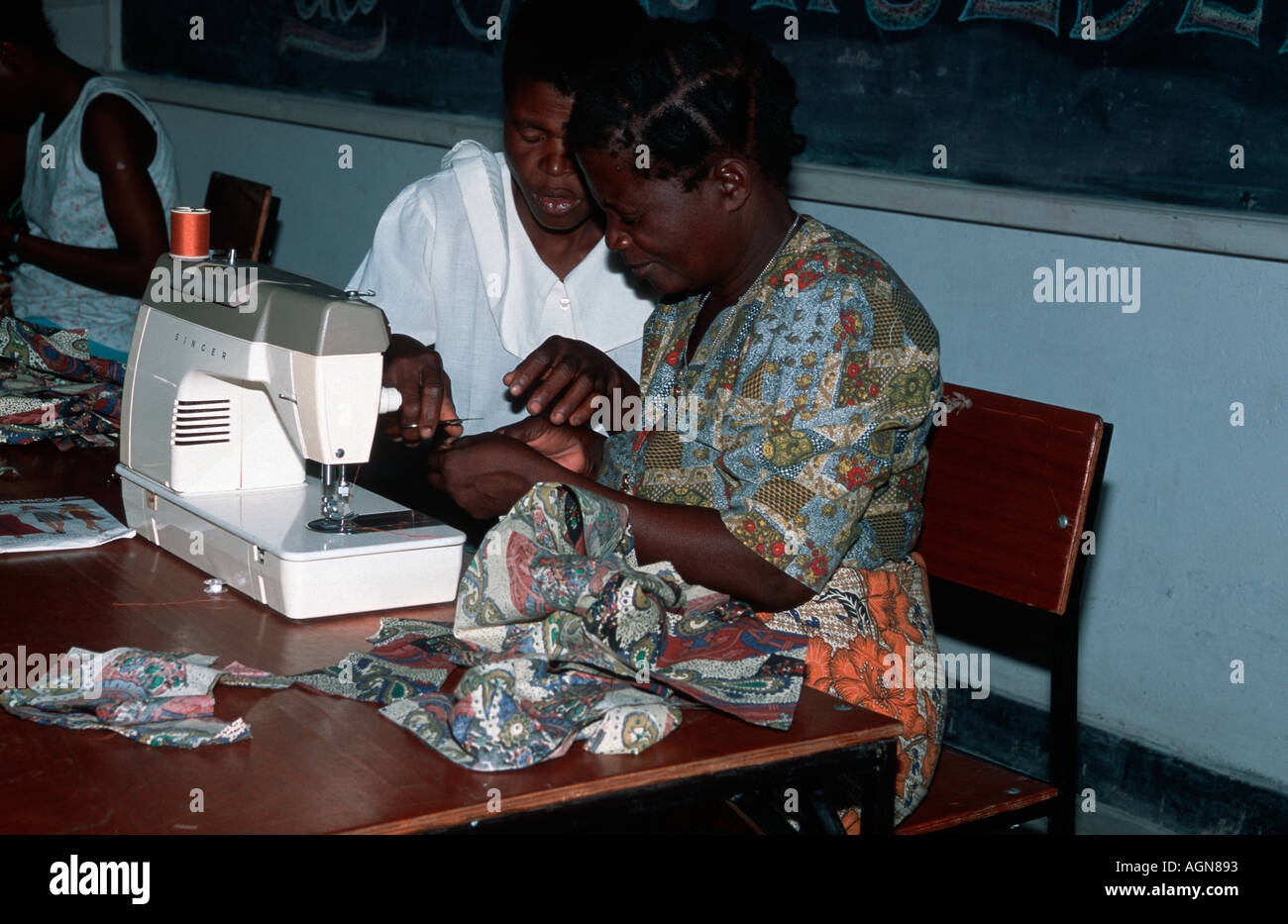 African women on sewing course using sewing machines donated by UK
