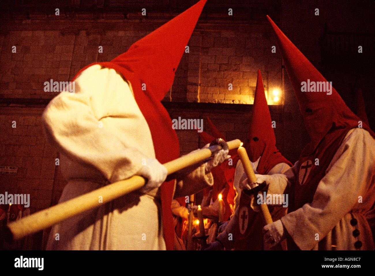 Redhooded penitents prepare to take part in a Holy Week procession in Zamora, western Spain Stock Photo