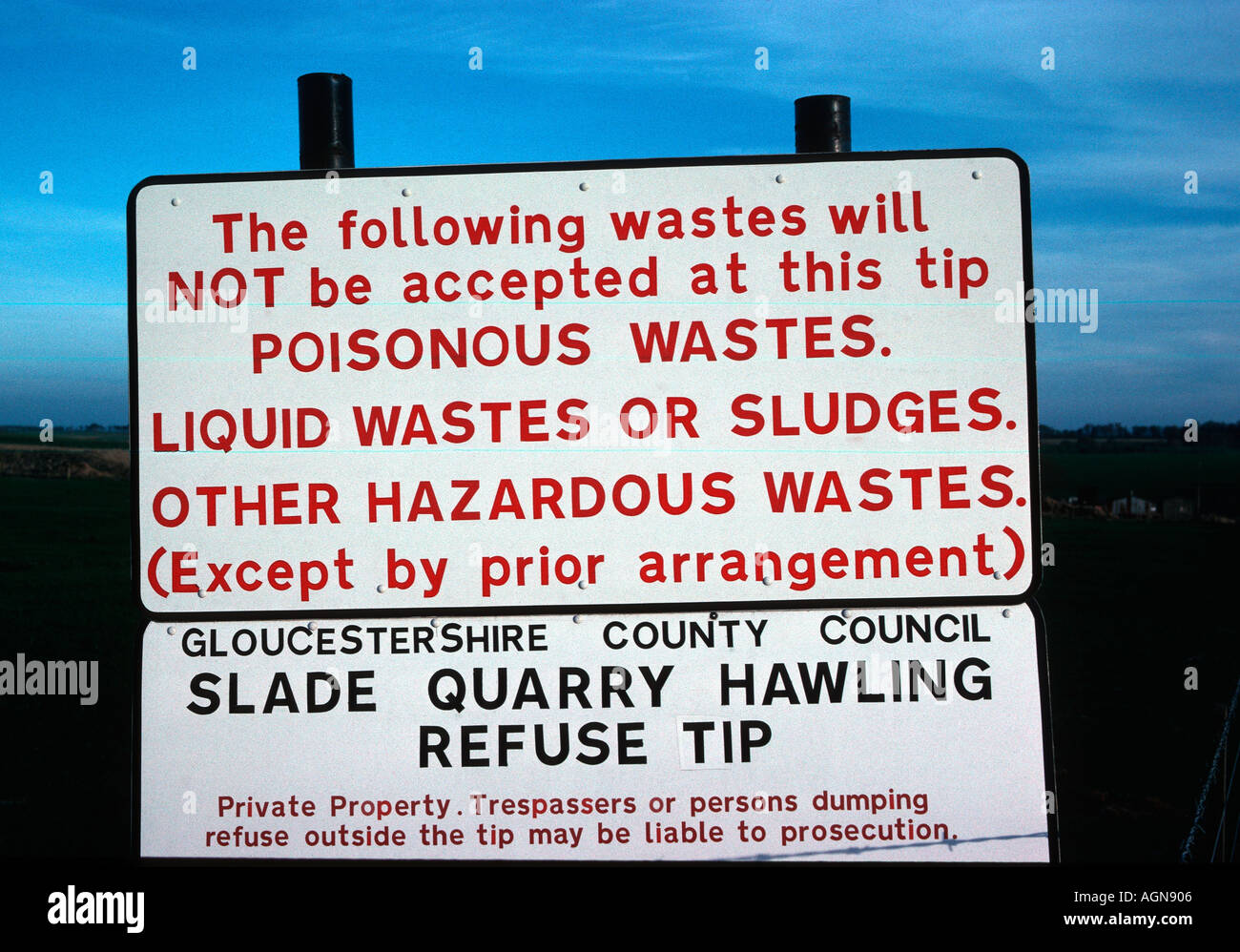 Sign prohibting dumping of toxic waste at quarry landfill site Cotswolds UK Stock Photo