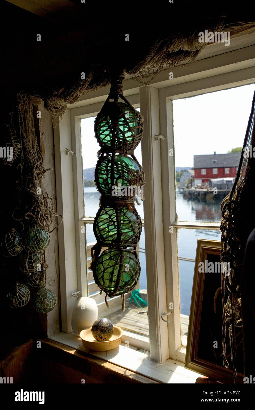 Fishnet with glass floats in a window near Kristiansund in More and Romsdal area on the west central coast of Norway Stock Photo