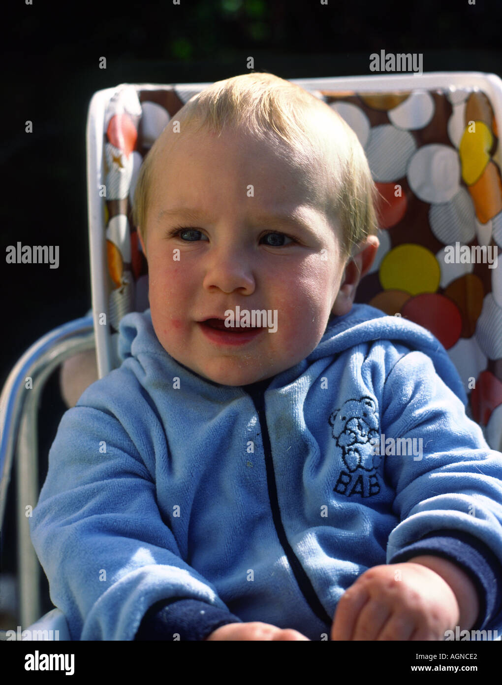 baby in high chair Stock Photo Alamy