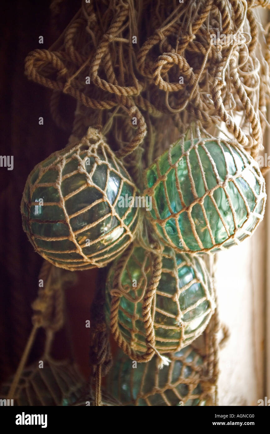 Antique Glass Fishing Net Floats on Glass Table Stock Photo - Alamy