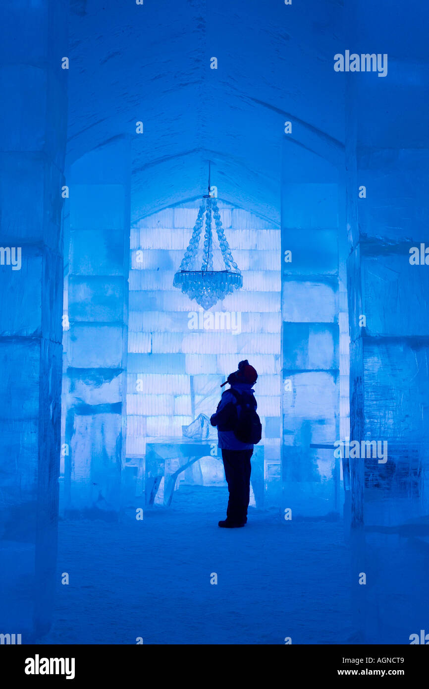 Person looking at the chandelier made of ice in the Ice hotel Jukkasjarvi Sweden Stock Photo