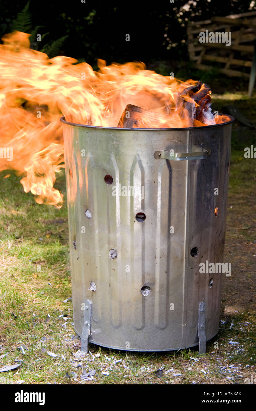 Domestic garden incinerator burning waste Stock Photo Alamy