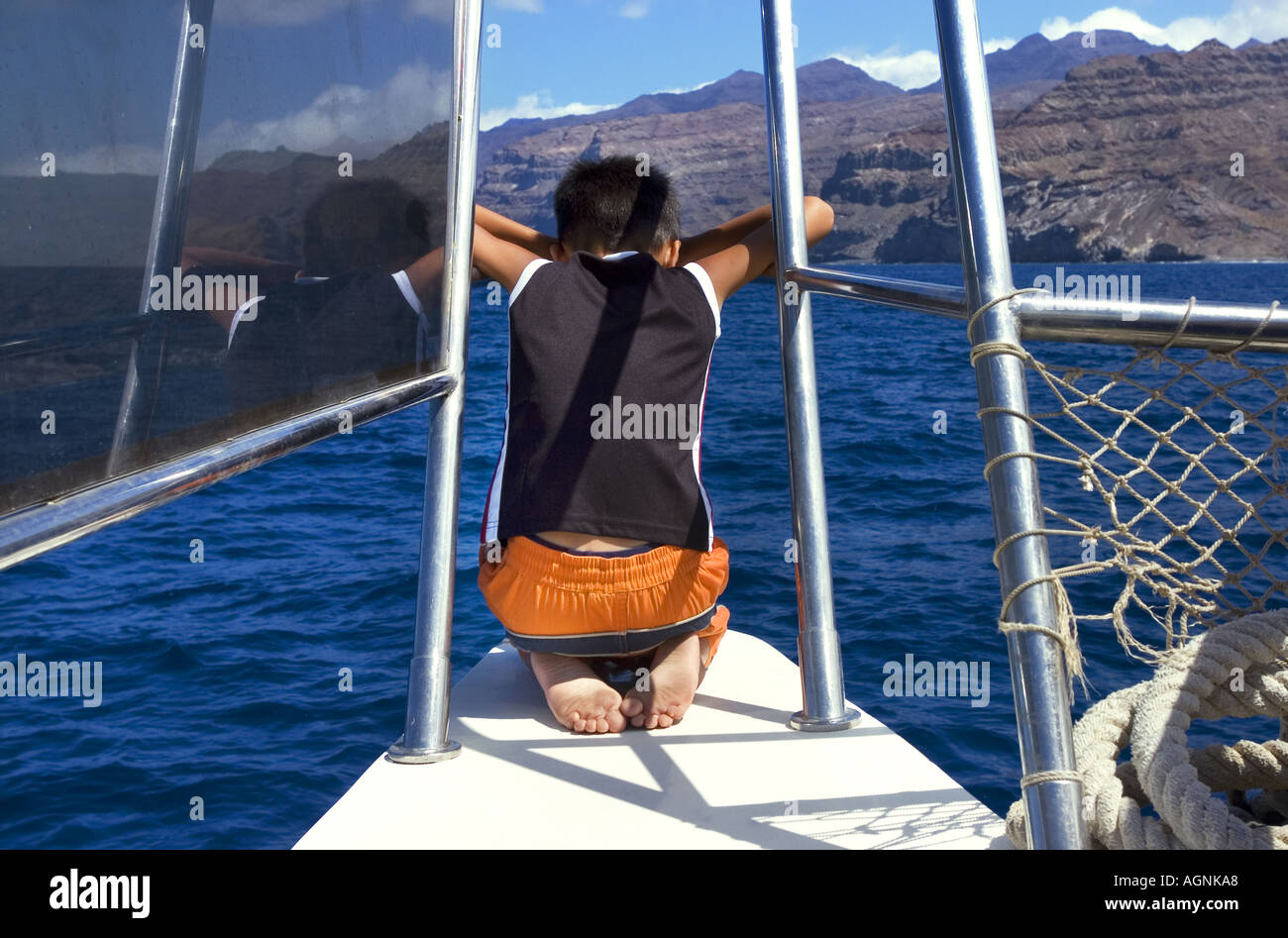 sailing the catamaran sea boy 8 years old eight hanging over the reling ...