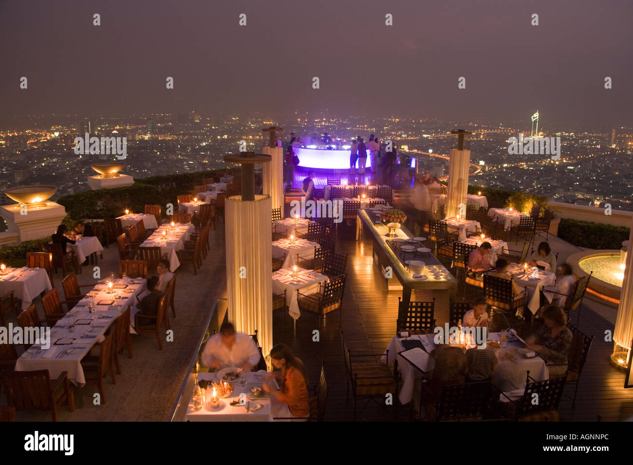 View over openair bar Sirocco Sky Bar and Bangkok in the evening State Tower 247 m The Dome Bangkok Thailand Stock Photo