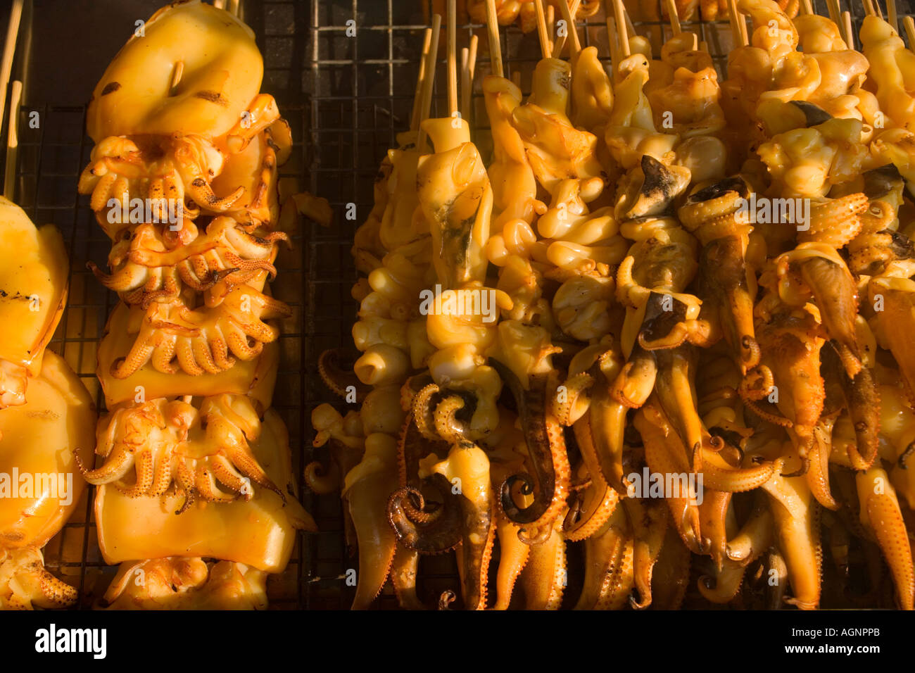 Grilled calamari Thai food offered at Suan Chatuchak Weekend Market Bangkok Thailand Stock Photo