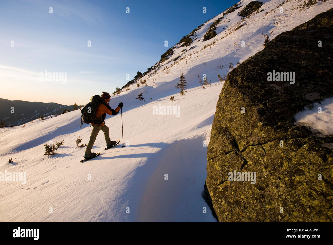 A man snowshoes in Tuckerman Ravine in New Hampshire s White Mountains Stock Photo
