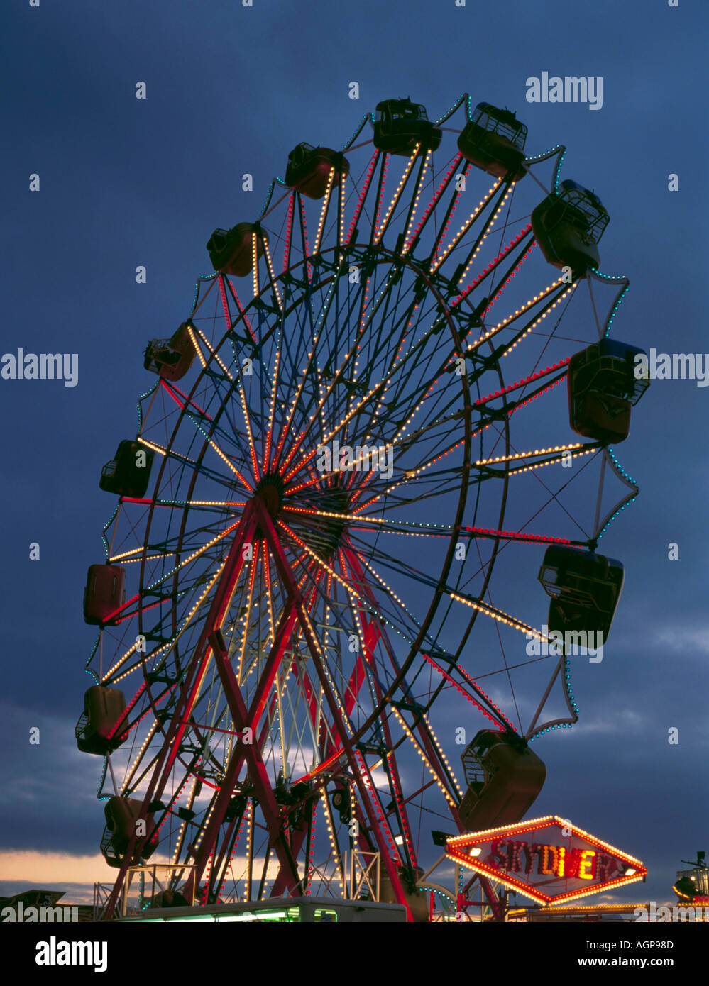Fairground ride at night; 'The Hoppings' on the Town Moor, Newcastle upon Tyne, Tyne and Wear, England, UK. Stock Photo