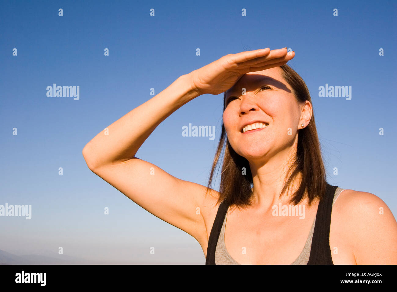 Shielding eyes from sun hires stock photography and images Alamy