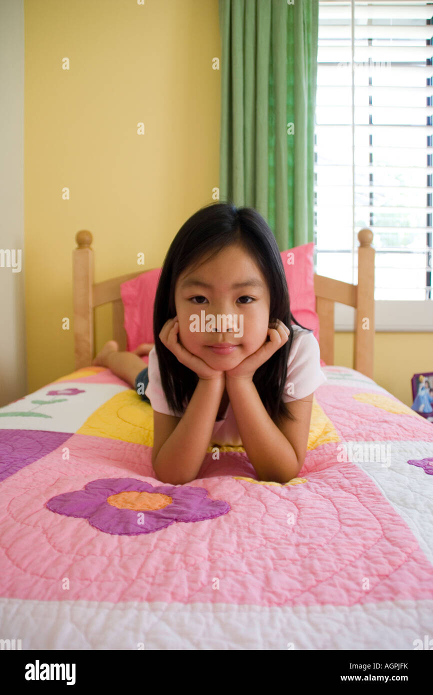 Young Girl Laying on Bed Stock Photo Alamy