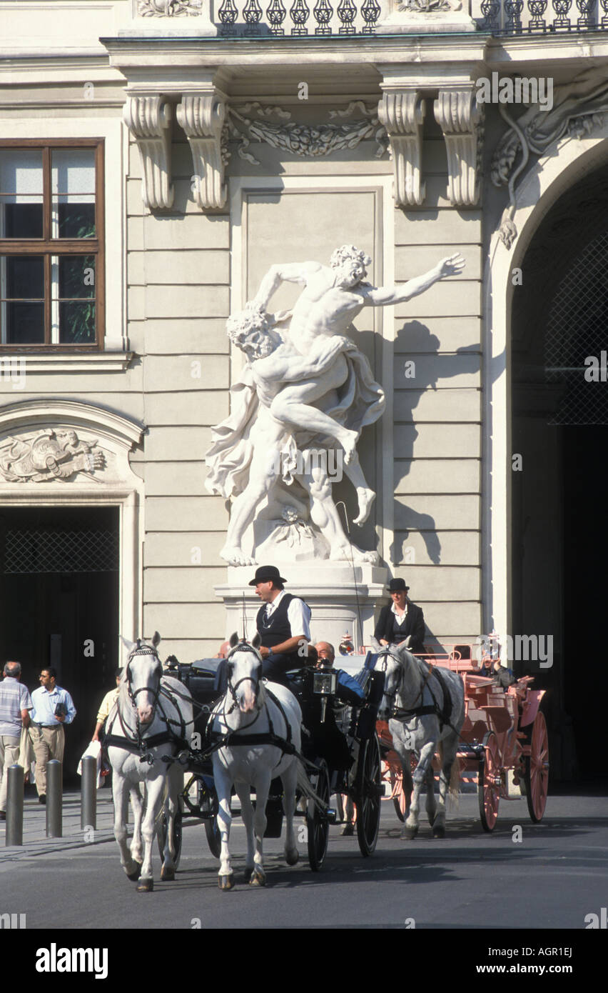 Hackney carriages in front of Alte Hofburg building near Heldenplatz in Vienna Austria Stock Photo