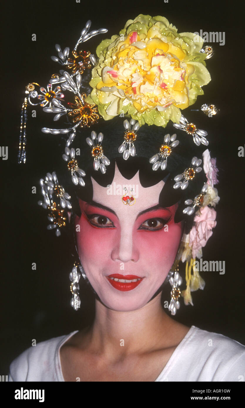 Beautiful Female Chinese Opera singer at Clarke Quay inSingapore in traditional makeup and costume Stock Photo
