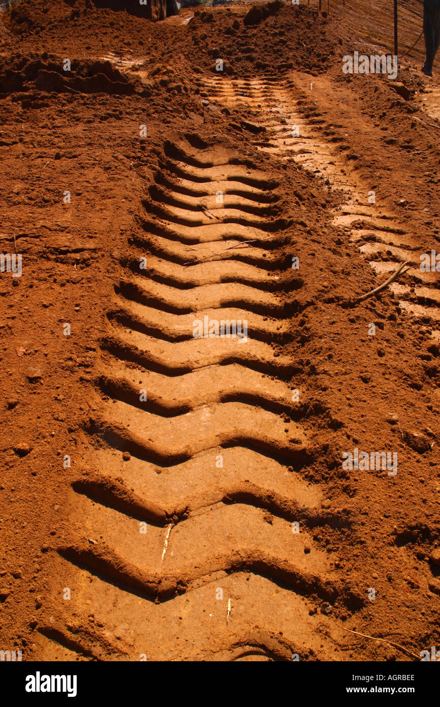 Tracks and wheel marks of Earth mover tractors working dam building tyre tracks tread Stock Photo