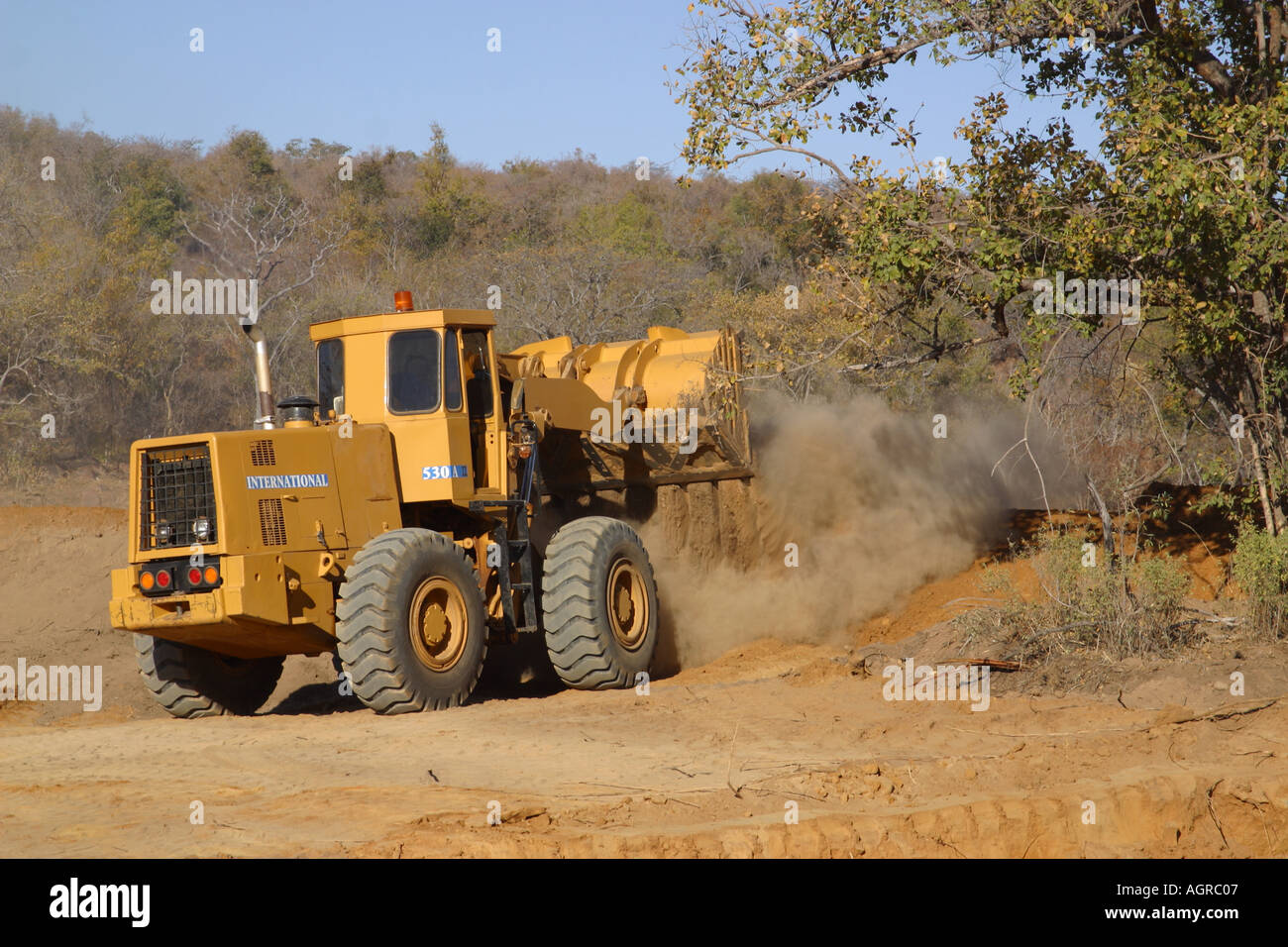 Earth mover tractors working dam building Stock Photo