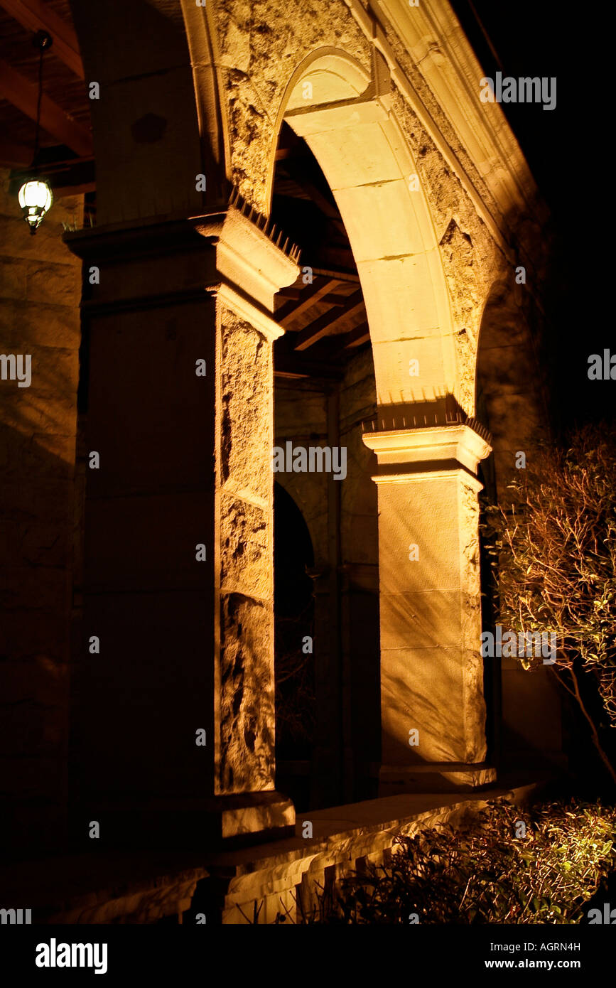 A well lit elaborate arch at night Stock Photo