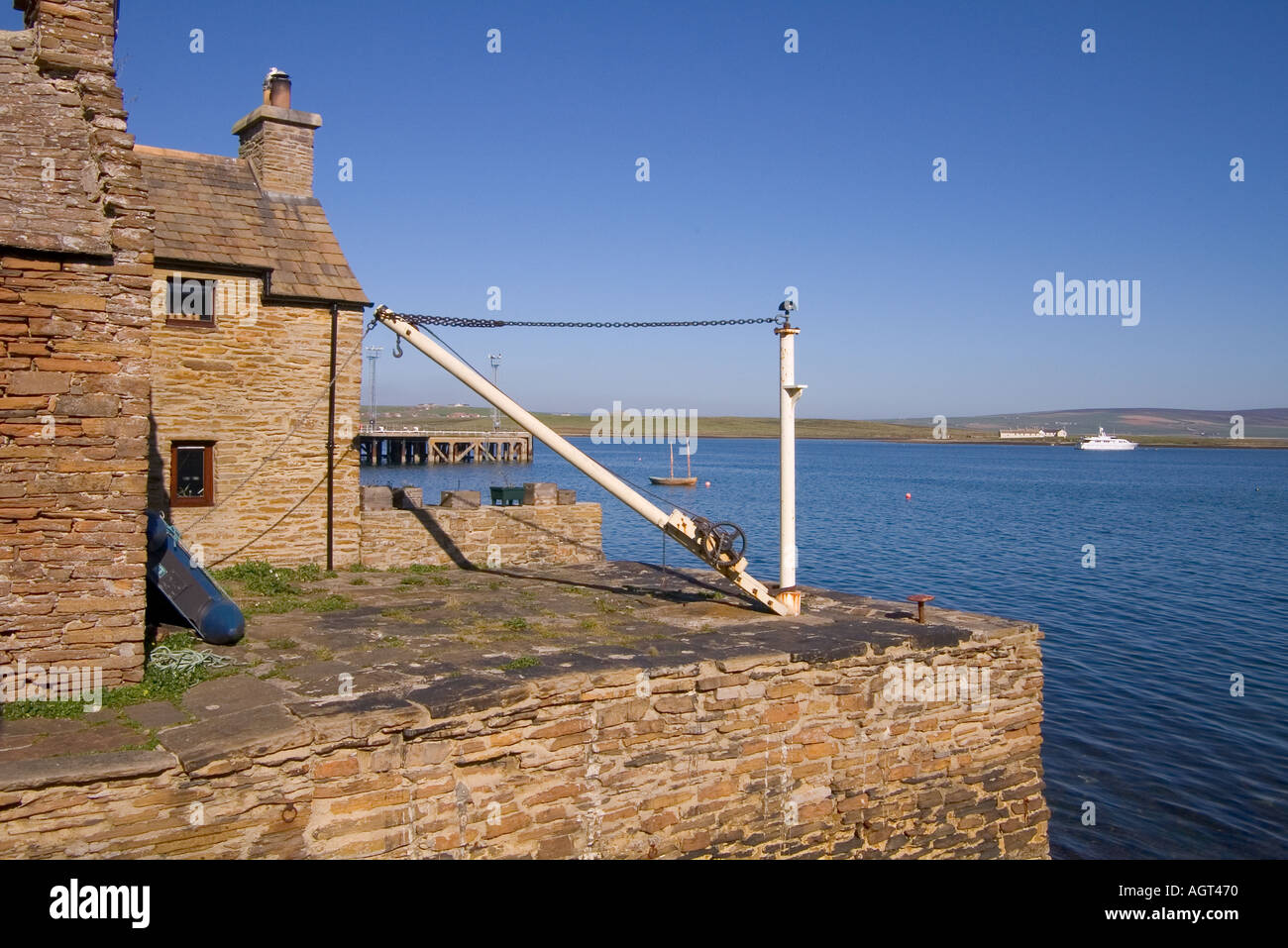 dh Waterfront STROMNESS ORKNEY Quayside houses jetty winch crane Stock Photo