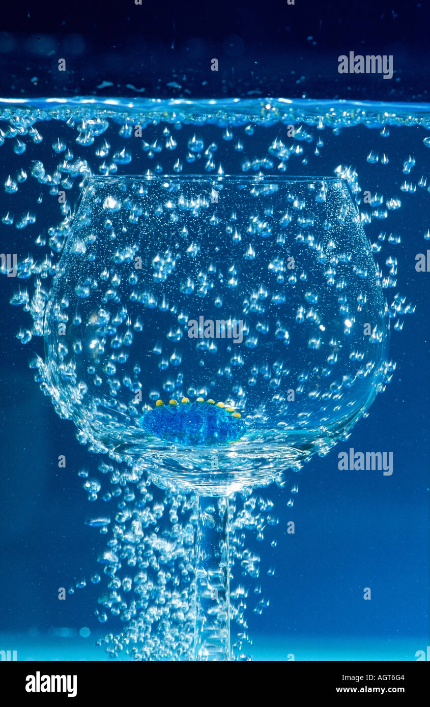 Air bubbles and tumbler under water / Luftblasen und Glas unter Wasser Stock Photo