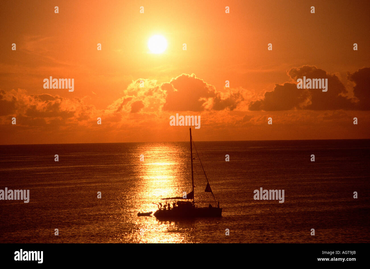 Sailing boat at sunrise Stock Photo