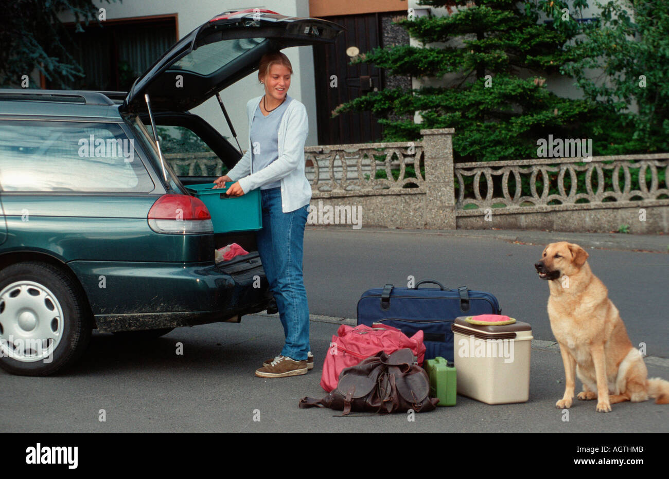 Woman packing car for travelling Stock Photo