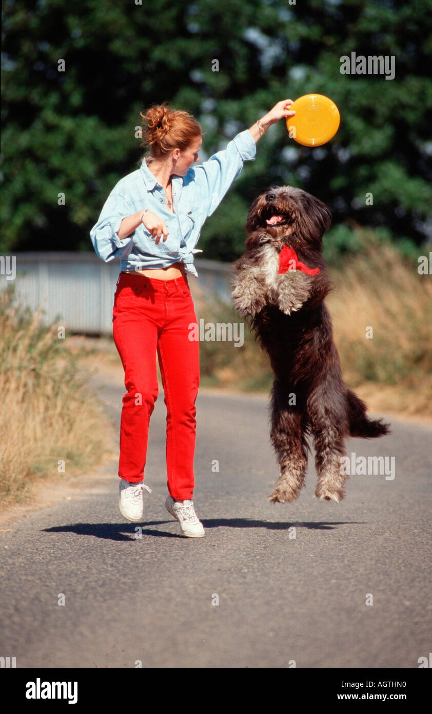 Woman with Mixed Breed Dog Stock Photo