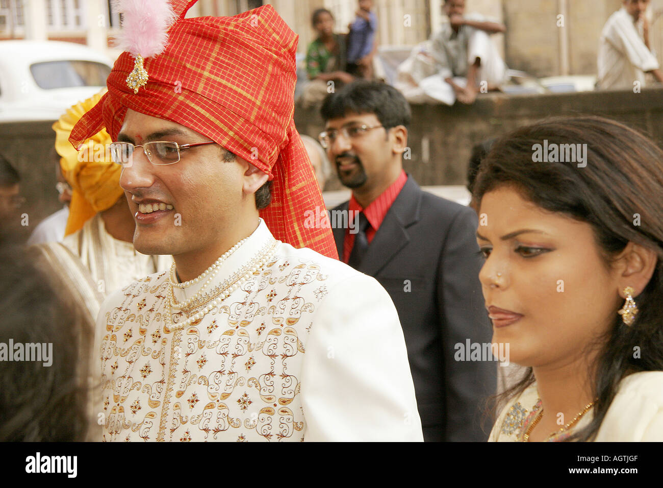 Indian Gujarati Bridegroom wearing turban and embroidered coat called Shervani with his sister on his wedding day India Stock Photo