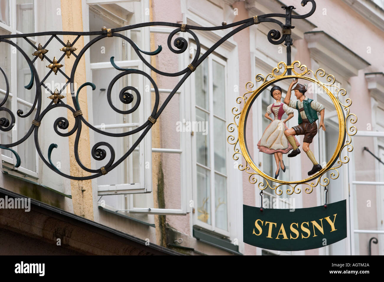 Wrought iron sign of the STASSNY fashionable Austrian clothing shop on Getreidegasse street. Salzburg, Austria. Stock Photo