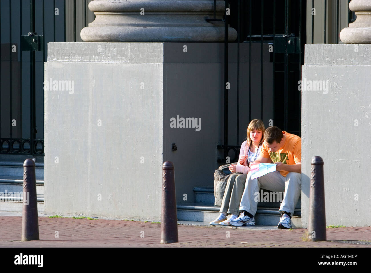 Couple reading a map at Waterloo Plein in Amsterdam Netherlands Stock Photo