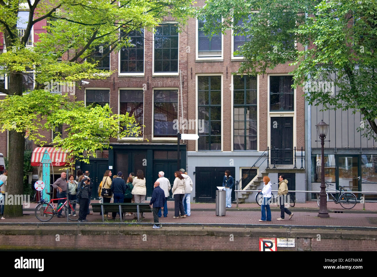 People stand in front of the Anne Frank House in Amsterdam Netherlands Stock Photo