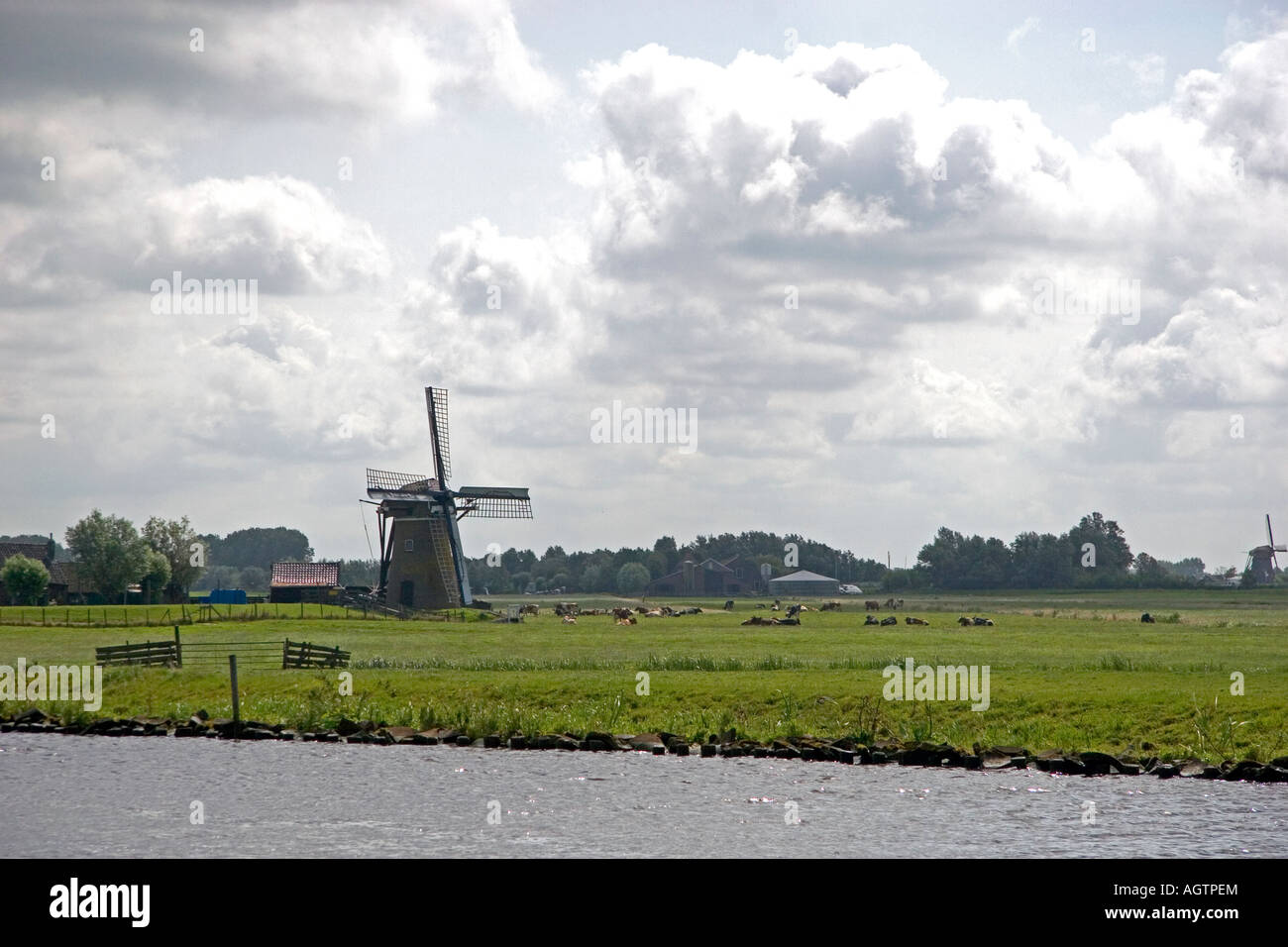 Windmills along a canal east of Leiden in the province of South Holland Netherlands Stock Photo