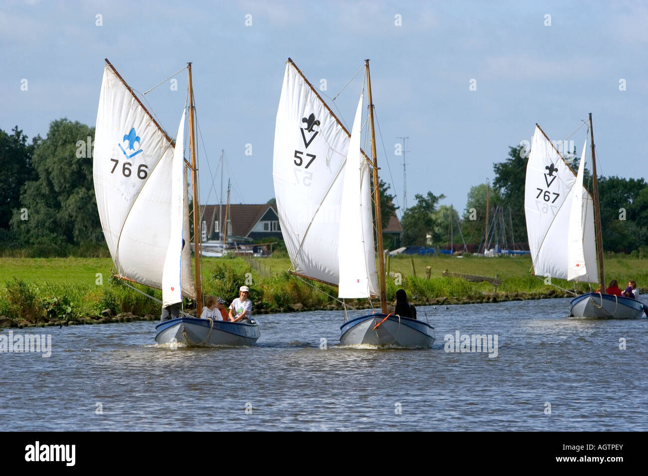 Sailboats travel on a canal east of Leiden in the province of South Holland Netherlands Stock Photo