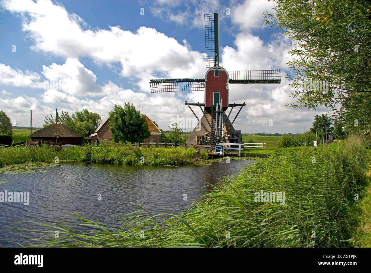 Windmill along a canal east of Leiden in the province of South Holland Netherlands Stock Photo