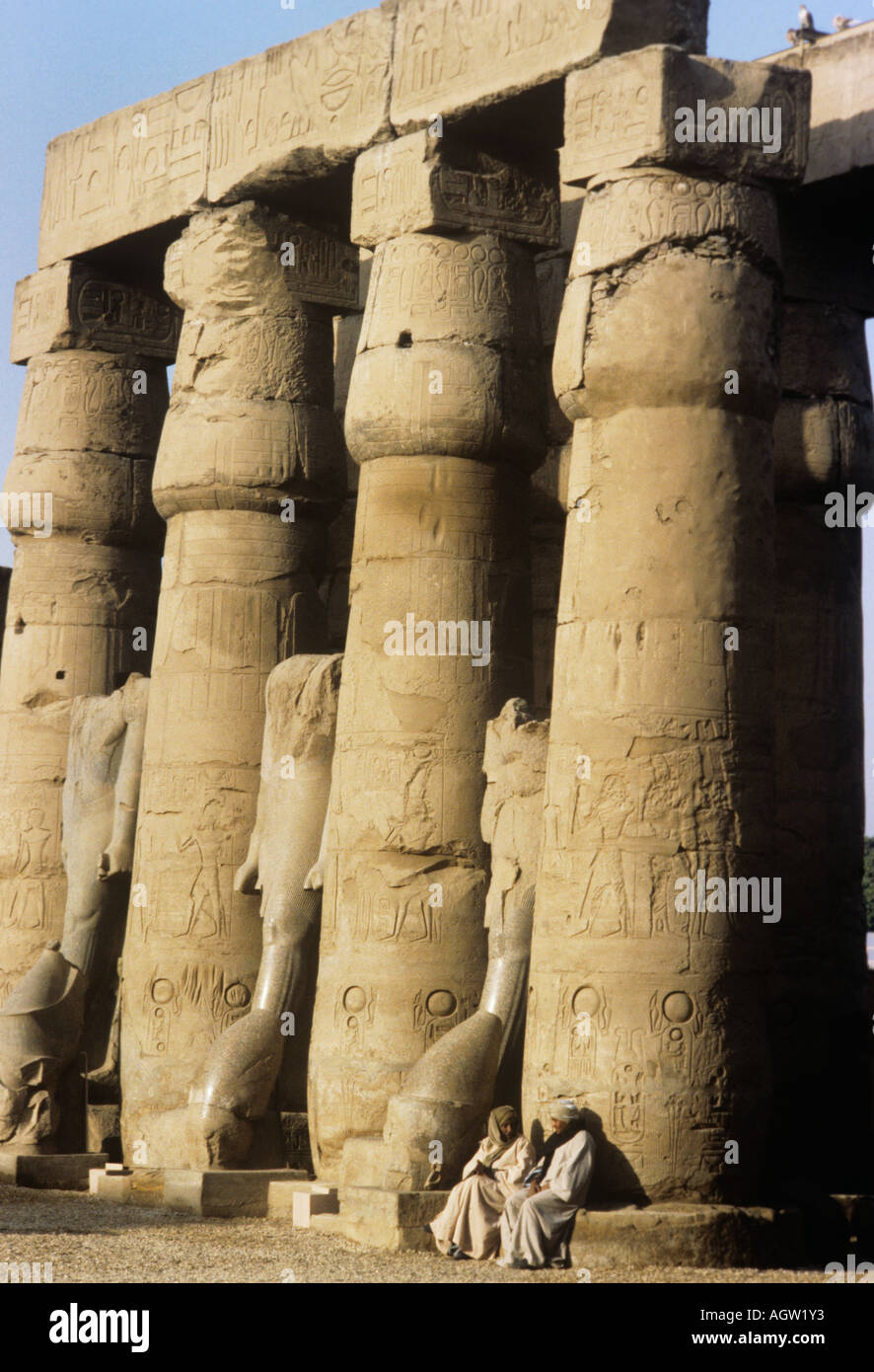 Egypt, The temple of Karnak with its lotus bud pillars, guides take a