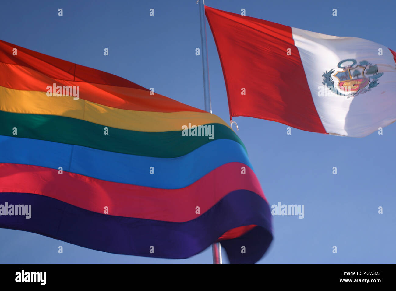 National flags of Peru and the Incan rainbow flag. The later has been adopted by the gay community Stock Photo