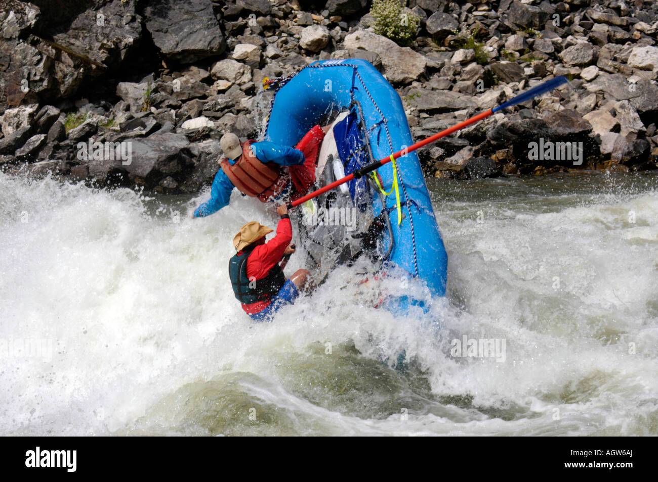 Rafters hit a huge wave and flip boat while rafting on the Middle Fork