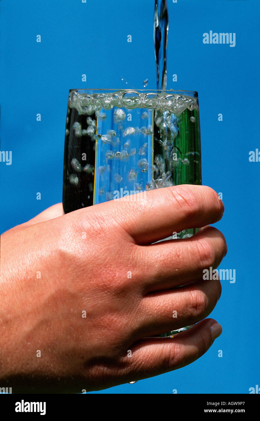 Hand with tumbler / Hand mit Wasserglas Stock Photo