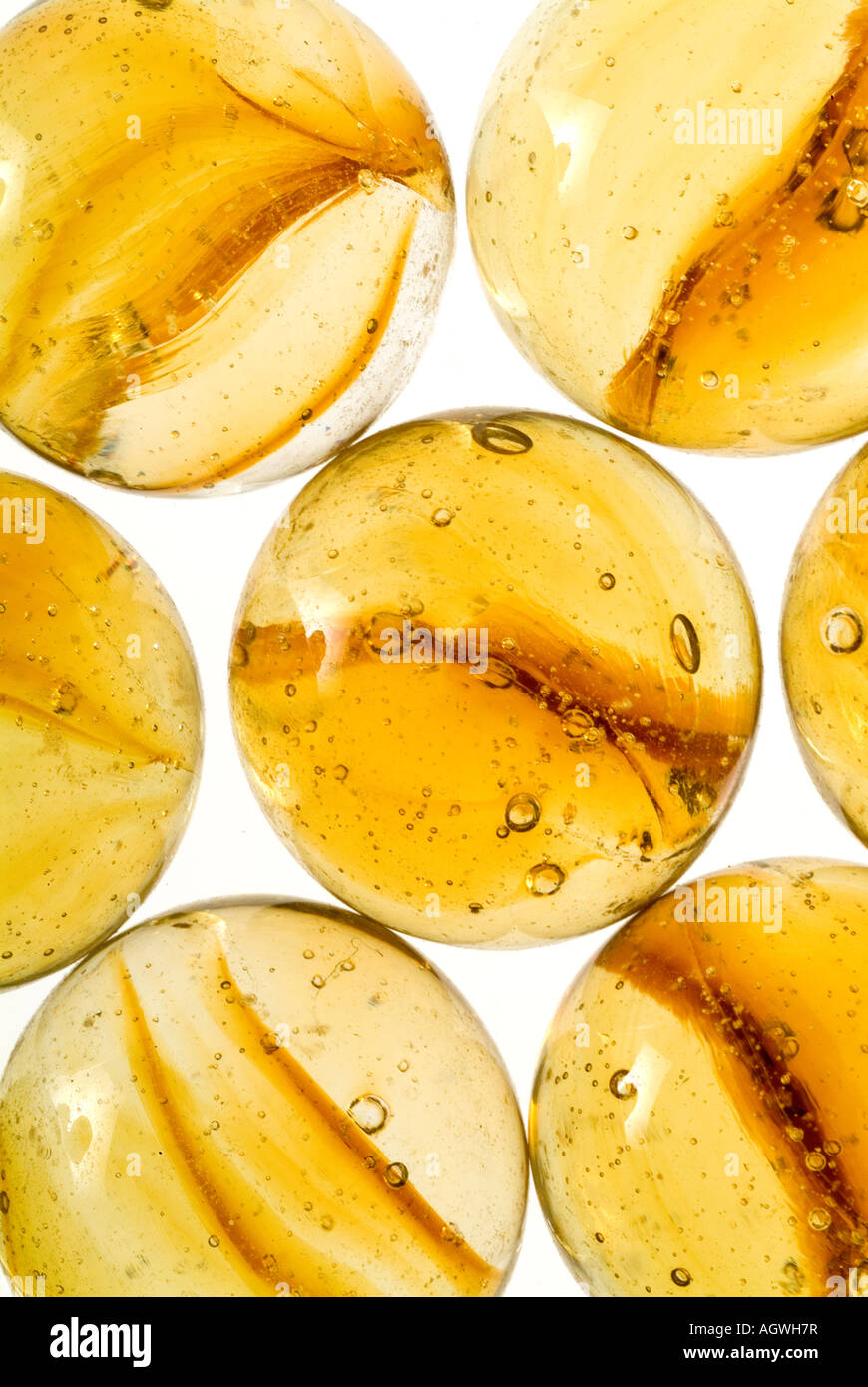 Amber glass marbles. Stock Photo
