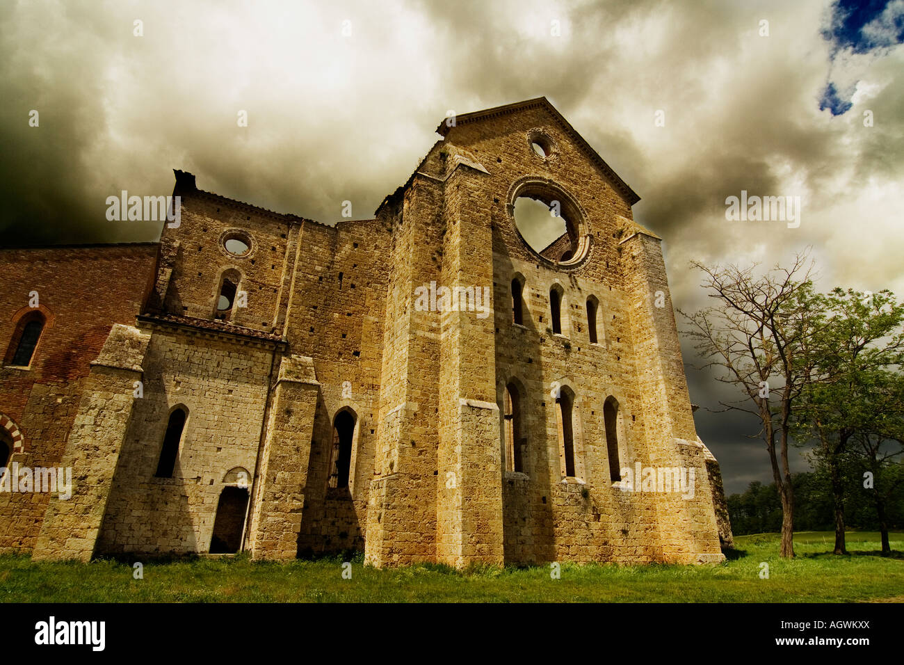 Exterior of Medieval San Galgano Abbey before storm. Chiusdino, Siena, Tuscany, Italy. Stock Photo