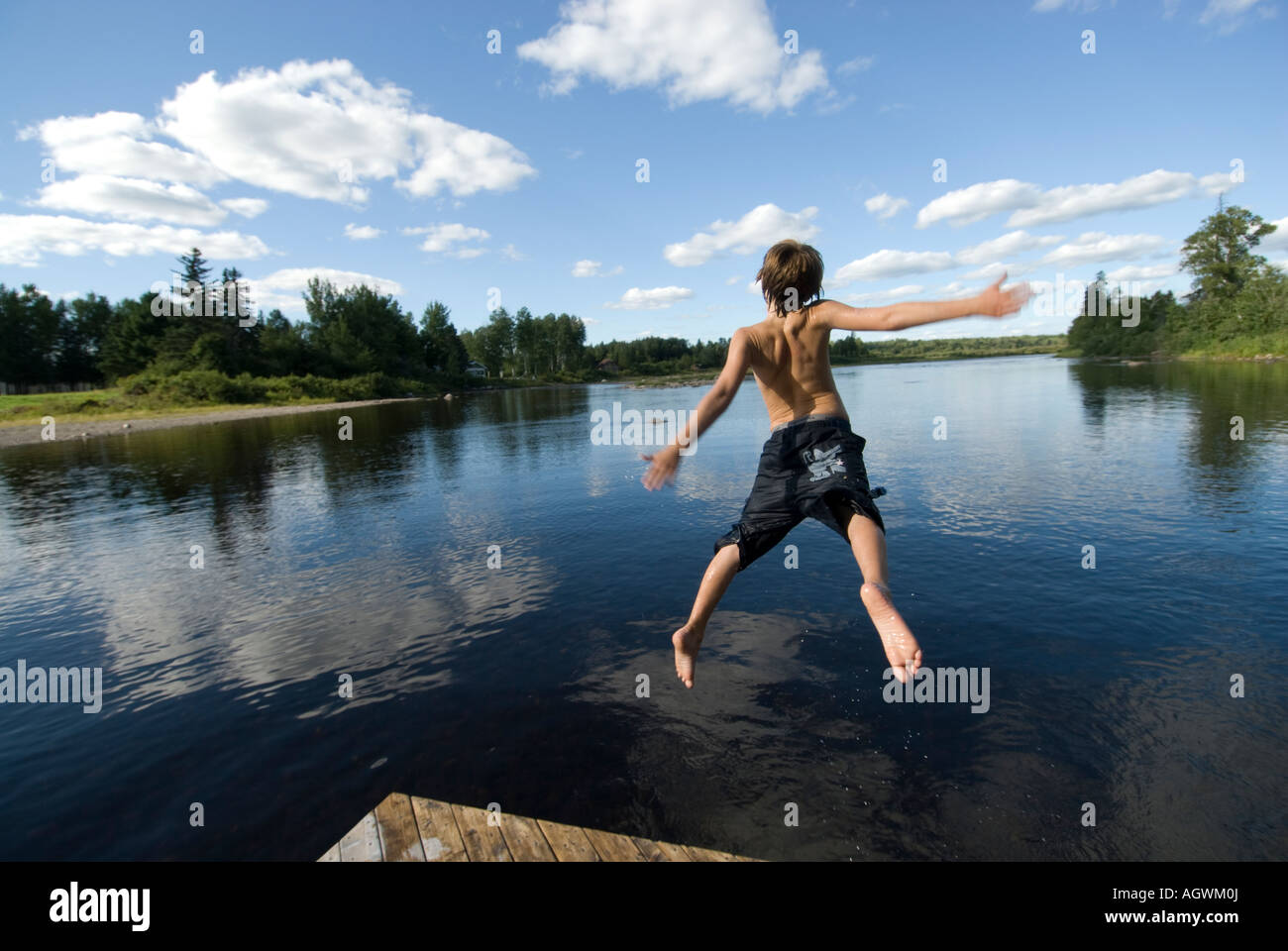 jumping in the river Stock Photo